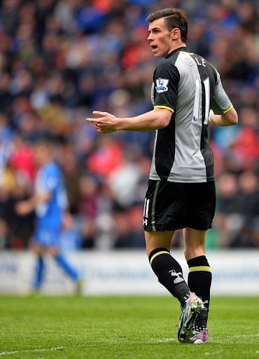 Tottenham's Gareth Bale gestures to the assistant referee after being caught offside, on April 27, 2013
